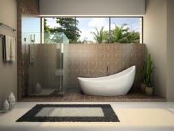 freestanding bathtub with glass enclosed shower and tile