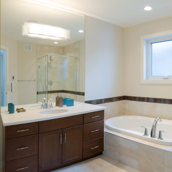 Bathroom with drop-in tub and vanity