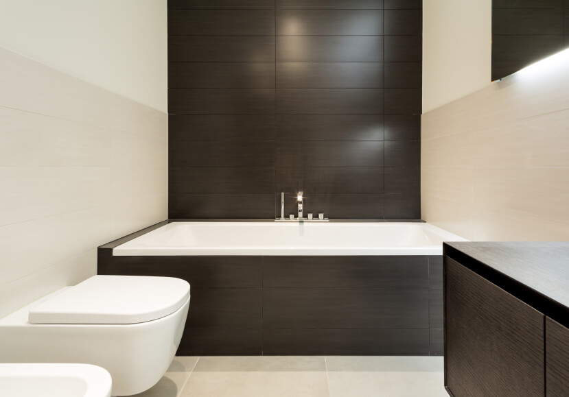 drop in alcove tub with dramatic black tile