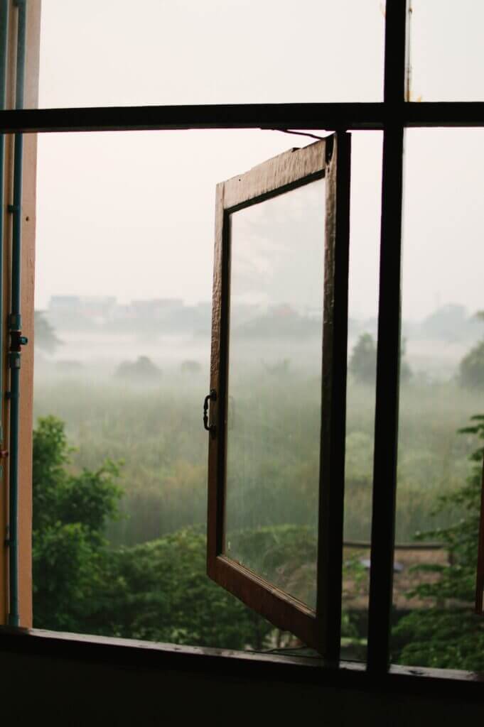 Image shows open window looking out onto a landscape