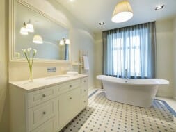 Image of bright white bathroom with pendant lighting in the middle of the room