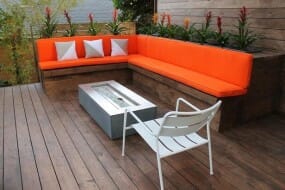Outdoor deck with bench seating and a fire pit