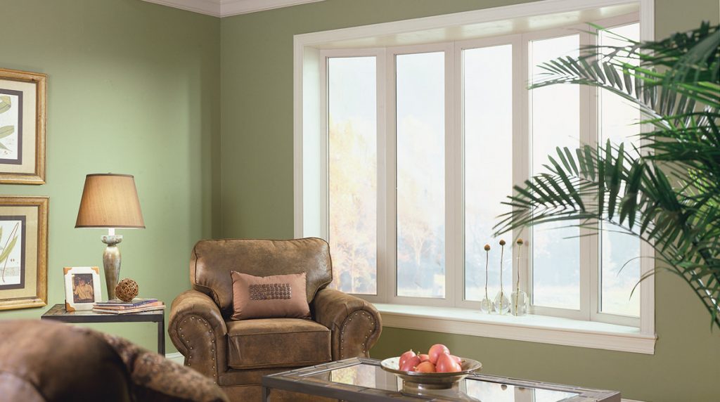 A bow window with white frames in a home's living room