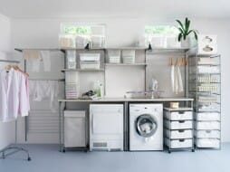 Image of a laundry room with lots of baskets, drawers, and storage