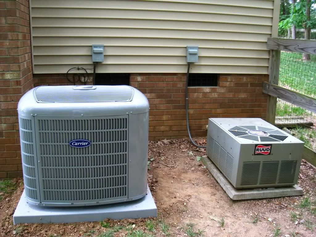 Picture of a heat pump next to an HVAC condenser