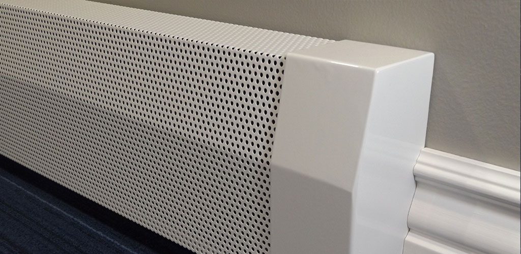 Close-up photograph of a white baseboard heater installed