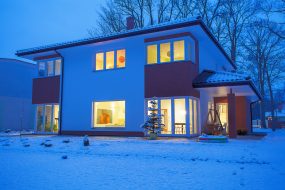 snowy flat roof home