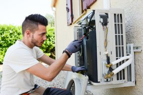 installer checking AC unit