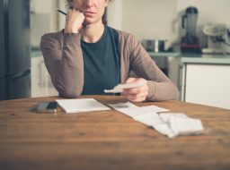 Woman looking at receipts