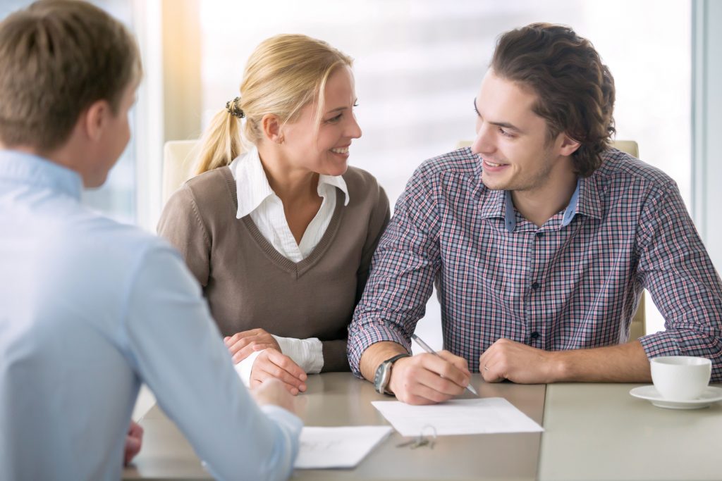 young couple at the bank