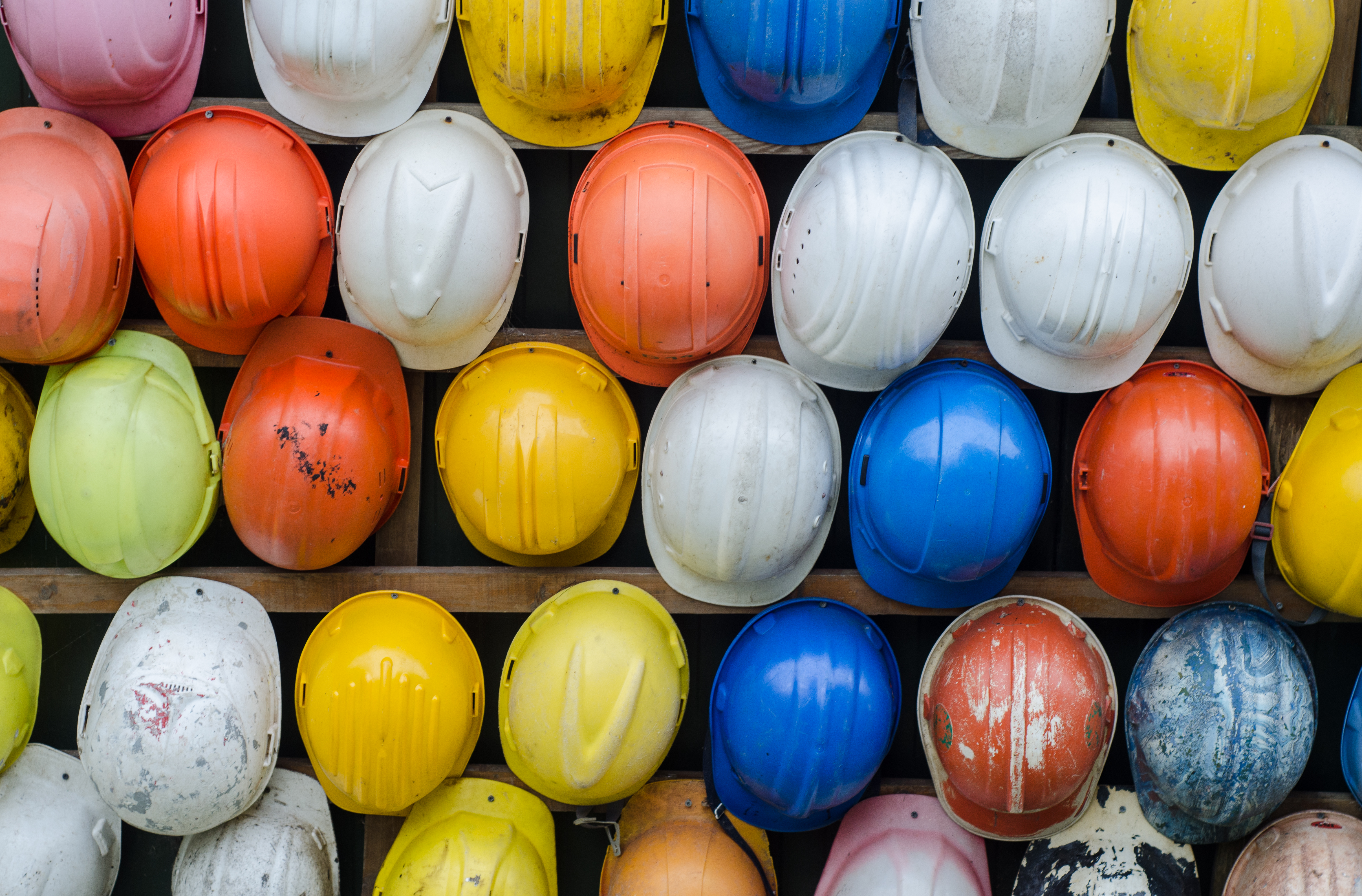 construction hats piled on one another