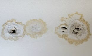 ceiling water damage due to bathroom leak