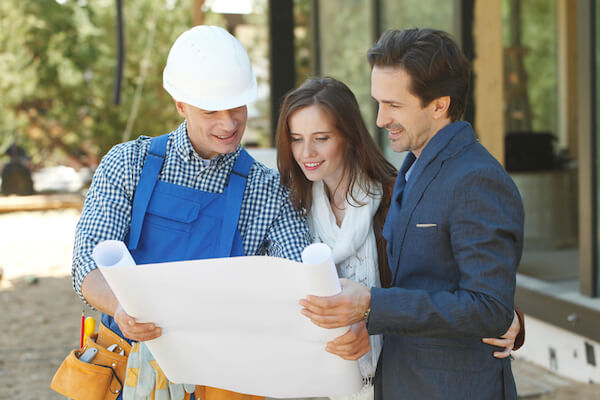 homeowners comparing contractors for home improvement project