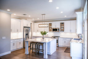 modern white kitchen cabinets in large kitchen