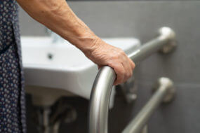 Senior woman using accessible bathroom