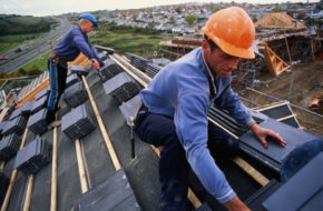 Roofer at work on new house, close-up