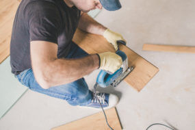 Man installing bamboo floors