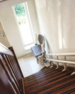Stairlift installed at the base of a staircase