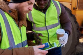 Contractors looking at ipad