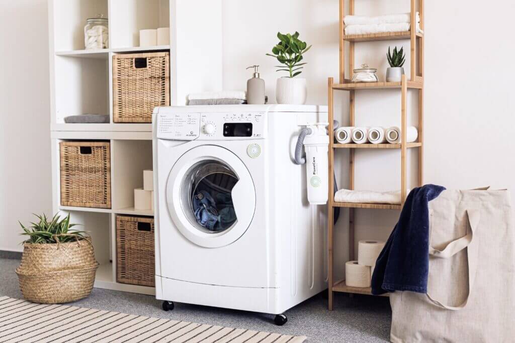 Photo of a laundry room with baskets and open shelving for storage