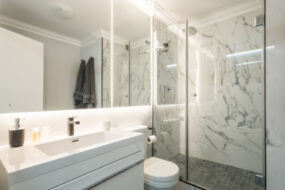 natural stone shower tile in a walk-in shower
