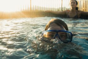 Child and parent in a hot tub