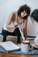 Couple painting a room
