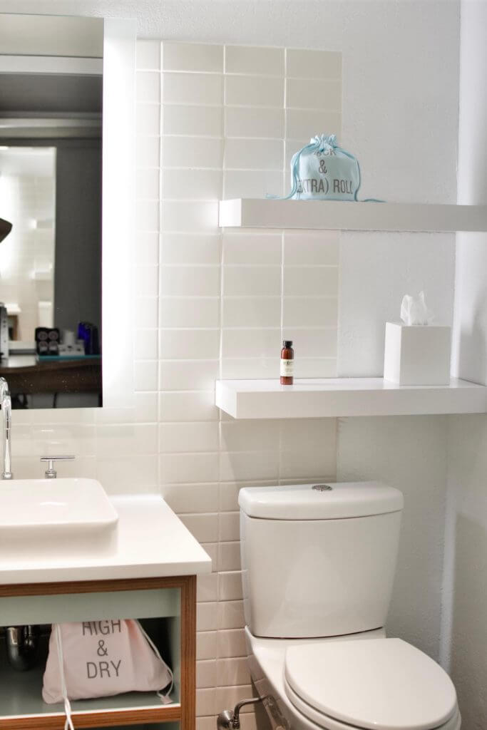 Small bathroom with floating shelves