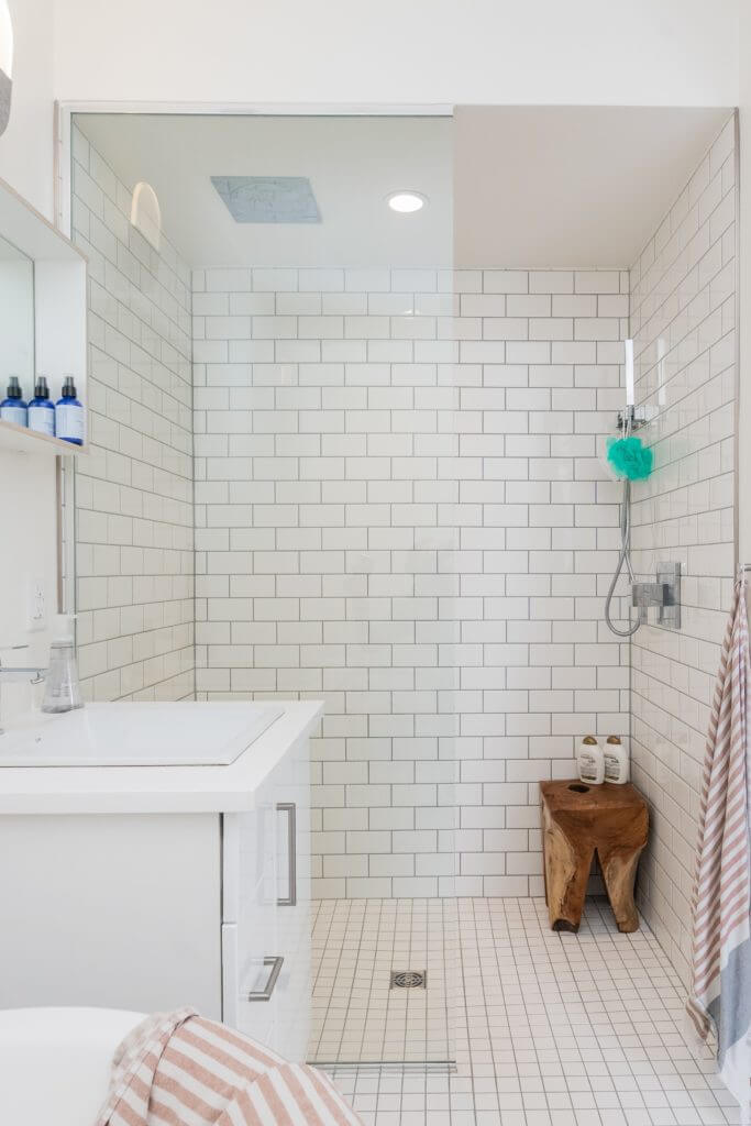 Small bathroom with frameless shower