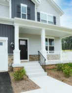 Home with steel siding mixed with stone trim