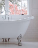 Clawfoot garden tub in white bathroom