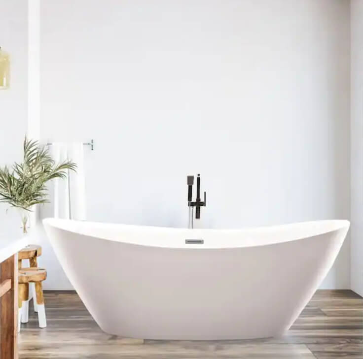 freestanding tub with black faucet