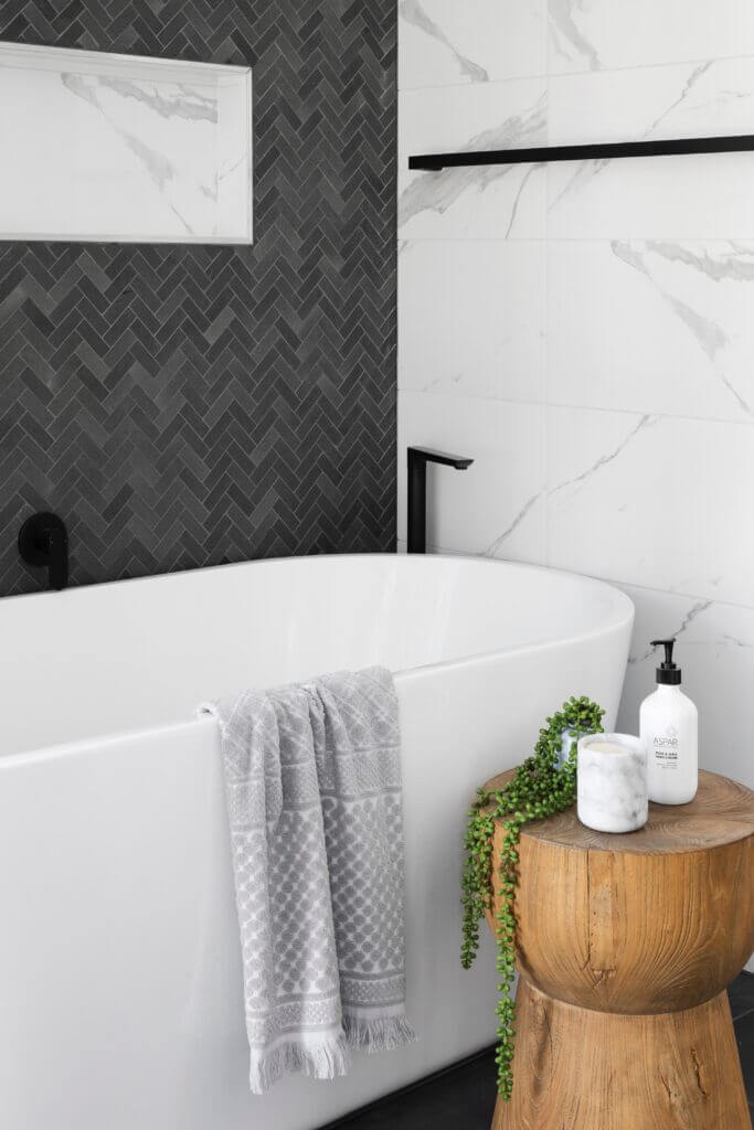 White tub with black faucet