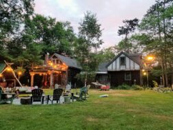 Image of a backyard area with a firepit and seating
