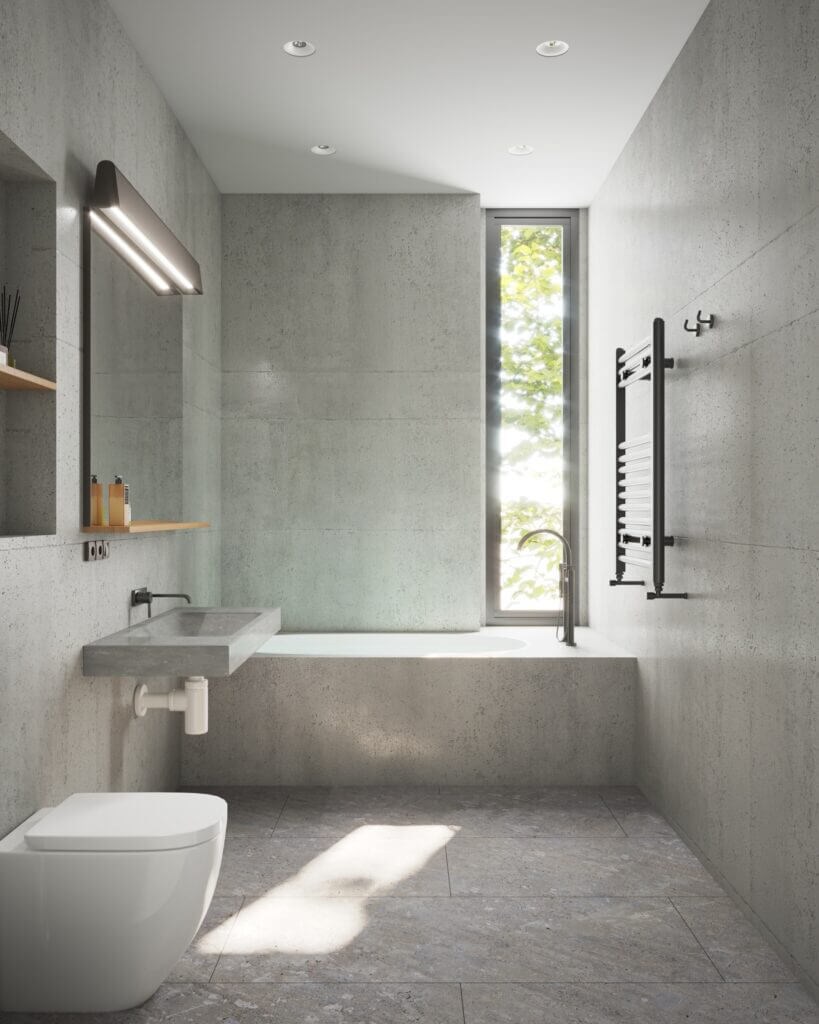 Image shows a gray concrete bathroom with recessed lighting