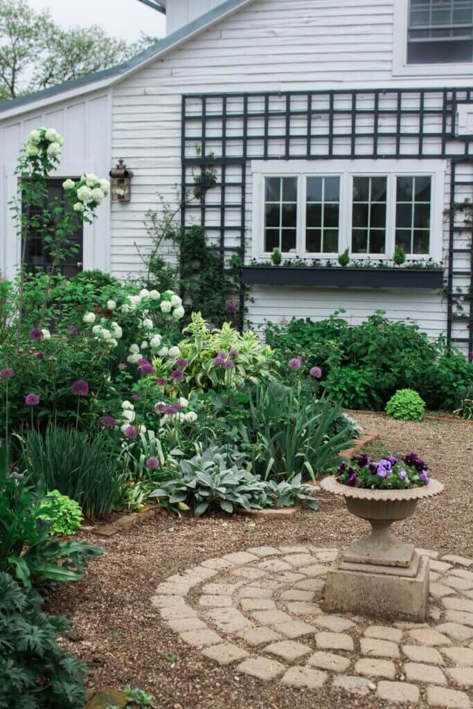 Image shows hardscaping in yard with paths and native plants