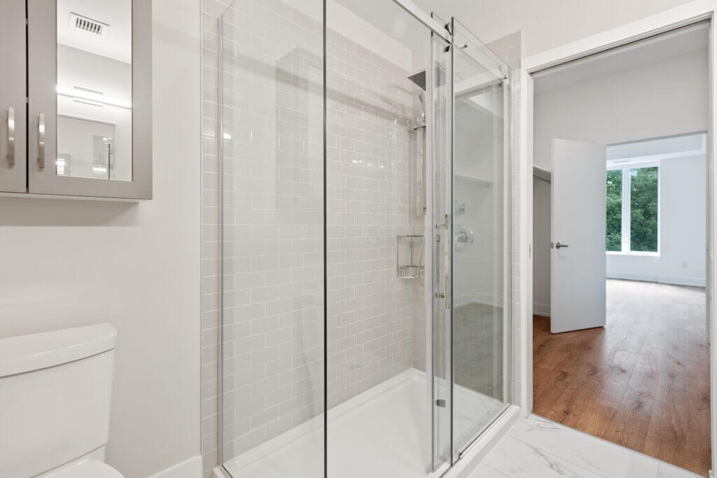 Glass shower with sliding pocket doors
