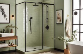 Black framed shower in a bright farmhouse bathroom