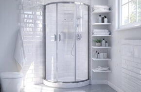 Small corner shower with storage shelves beside it