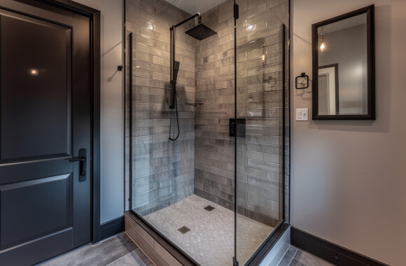 Sleek, black-framed corner shower