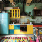 A mix of blue and yellow work together to create this dopamine-filled kitchen