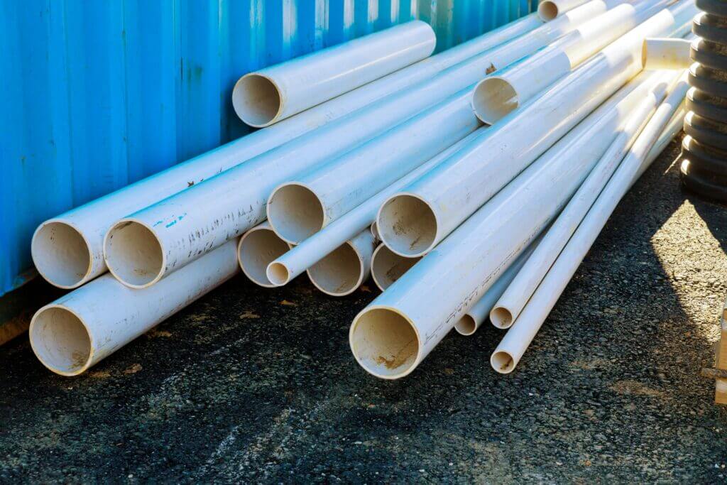 Image of a pile of PVC pipes in various sizes for residential use