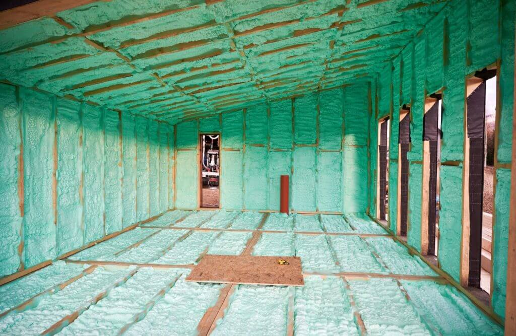 Empty attic framing with spray foam insulation