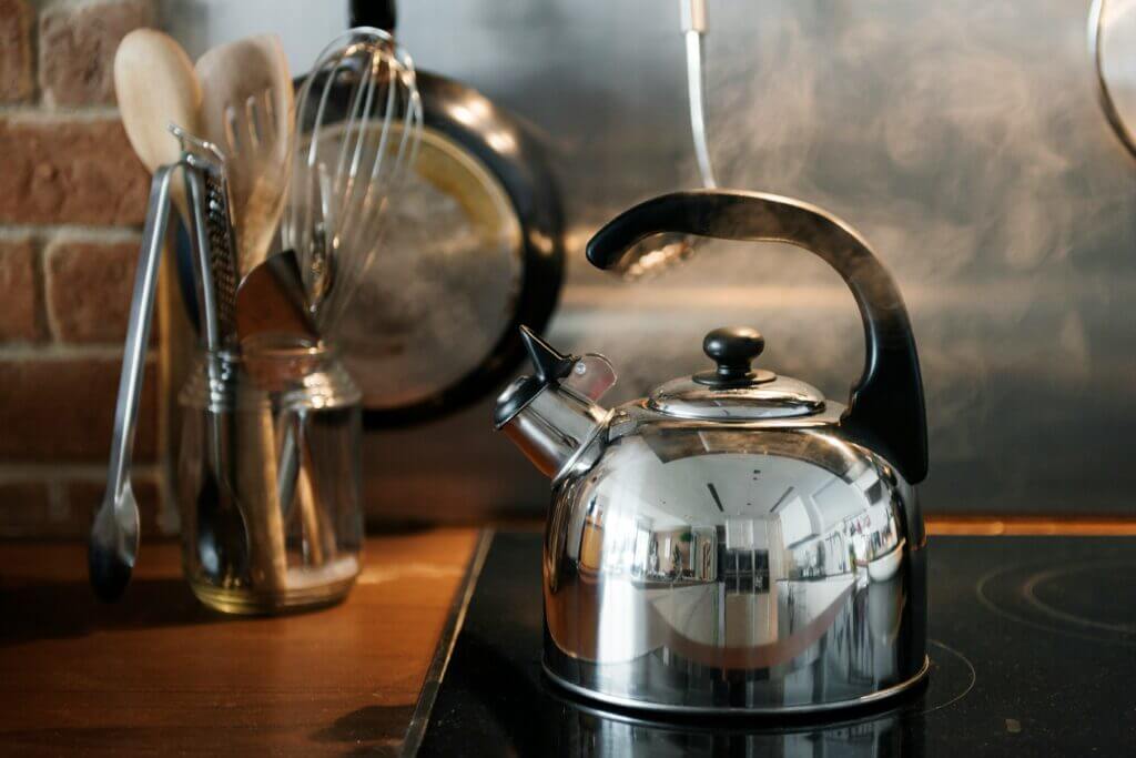 Kettle on stove boiling water