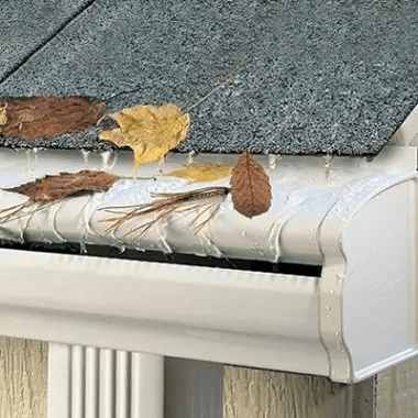 LeafGuard gutter guards blocking leaves and other debris during a rain storm