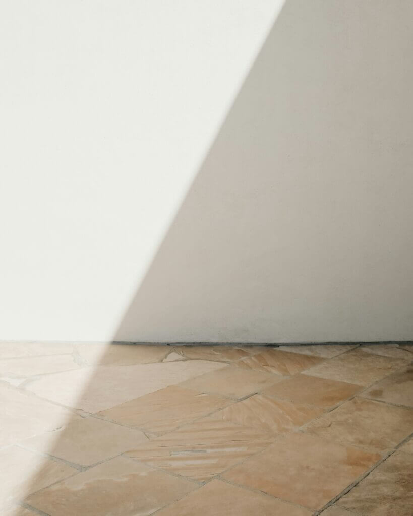 Image of a gap between a tile floor and drywall