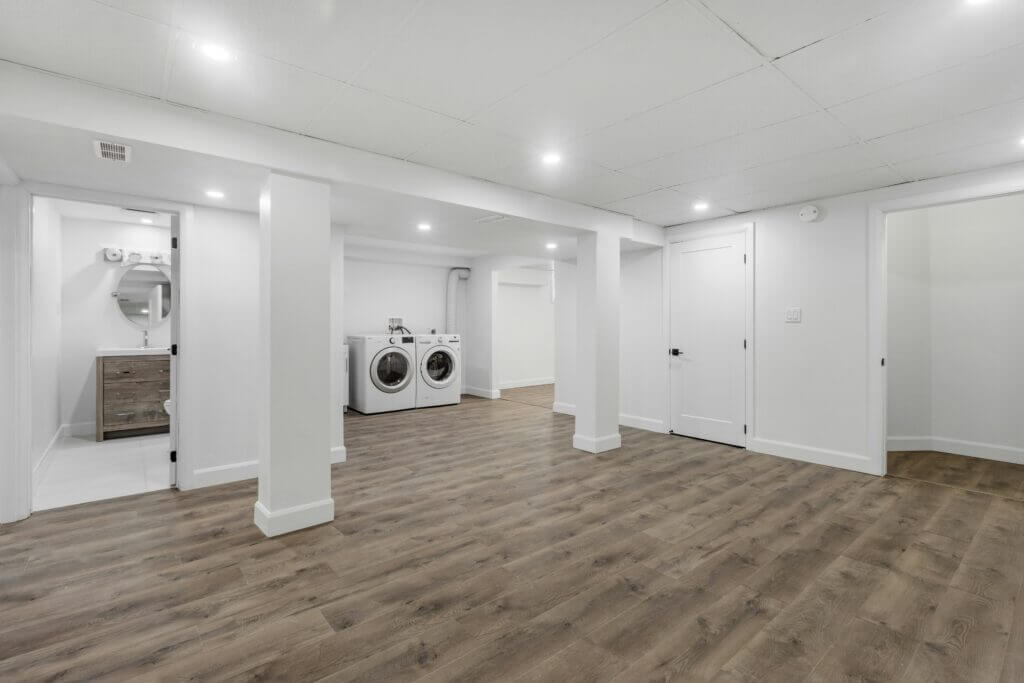 Refinished basement with laundry, at risk of water damage so in need of waterproofing