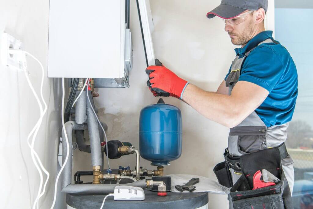 Contractor installing a tankless water heater