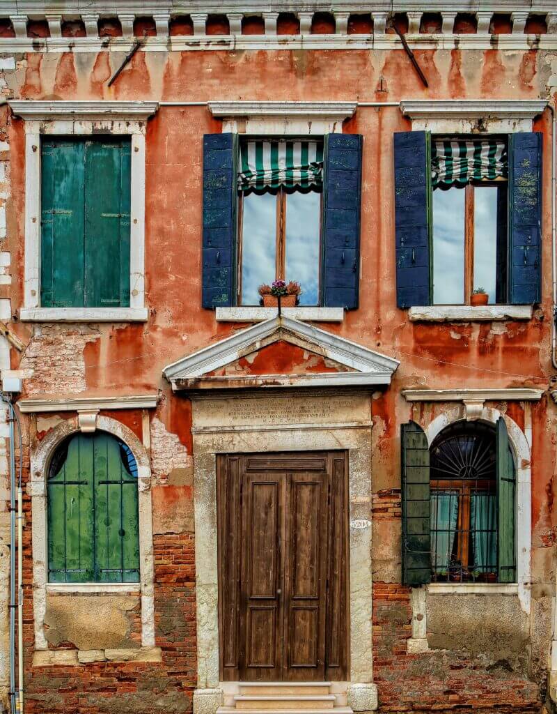 Image of a home with crooked windows and door