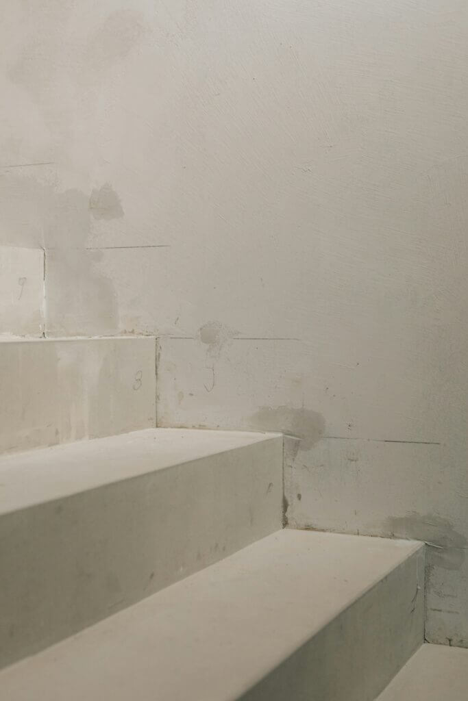 Dampness along stairs and wall